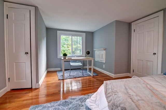 bedroom with light hardwood / wood-style floors