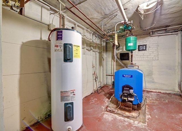 utility room featuring water heater