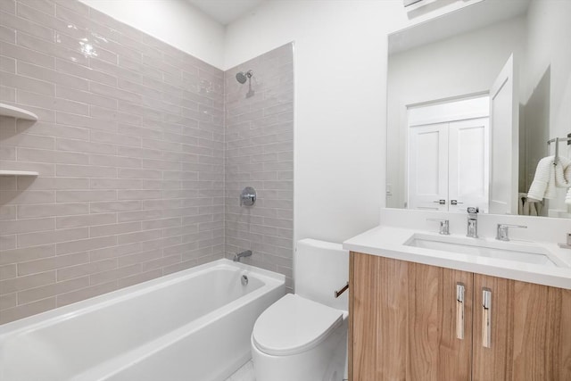 full bathroom with toilet, vanity, and tiled shower / bath combo