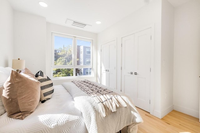 bedroom with light wood-type flooring