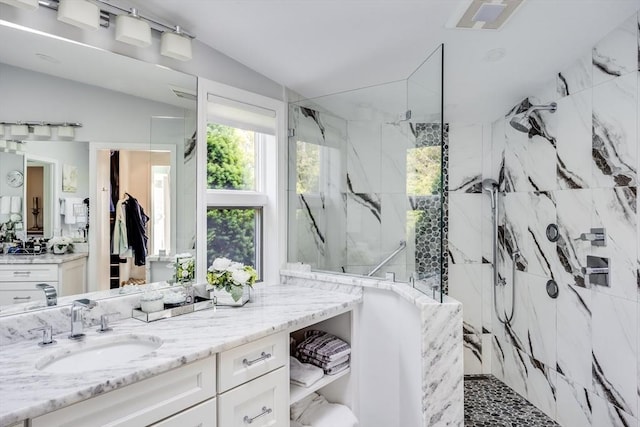 461 Wings Neck Rd, Bourne, MA 02559 - bathroom featuring a marble finish shower, vanity, and vaulted ceiling