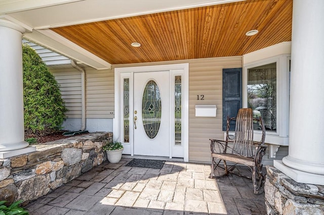 doorway to property featuring covered porch