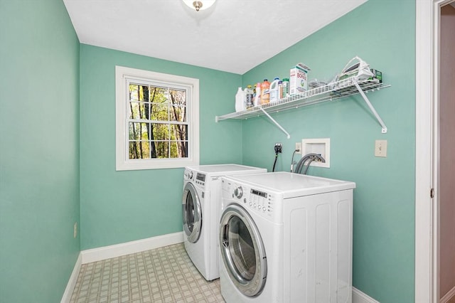 laundry room with washer and dryer, laundry area, baseboards, and light floors