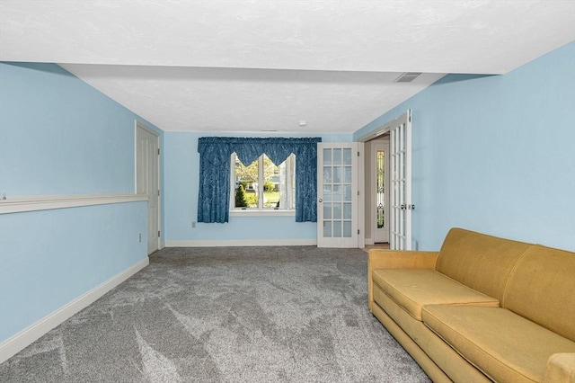 living area with french doors, baseboards, carpet flooring, and visible vents