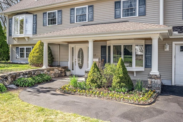 doorway to property featuring a porch