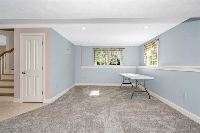 interior space featuring carpet flooring, recessed lighting, baseboards, and stairs