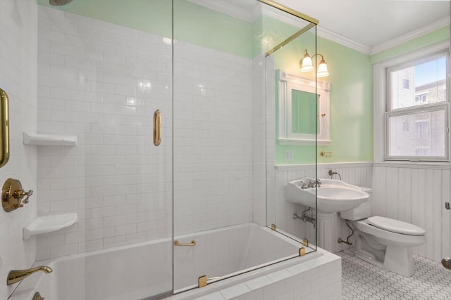 8 Browne St Unit 1, Brookline, MA 02446 - bathroom with combined bath / shower with glass door, a wainscoted wall, toilet, and ornamental molding