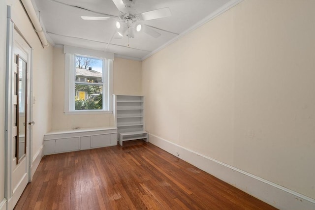 8 Browne St Unit 1, Brookline, MA 02446 - empty room featuring ornamental molding, baseboards, ceiling fan, and dark wood-style floors