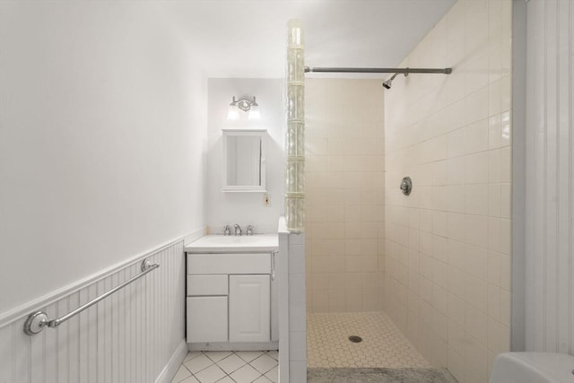 8 Browne St Unit 1, Brookline, MA 02446 - bathroom featuring vanity, tile patterned flooring, and a tile shower