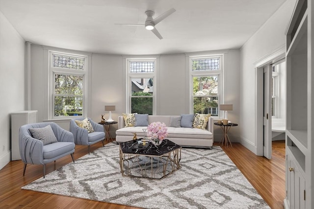 8 Browne St Unit 1, Brookline, MA 02446 - living room featuring a ceiling fan, baseboards, and wood finished floors