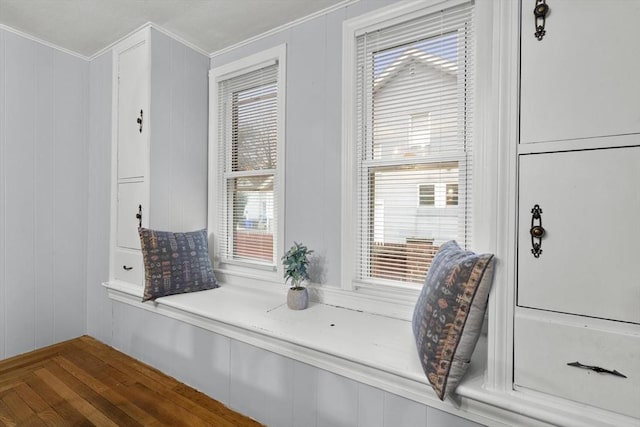 interior space with crown molding and wood finished floors