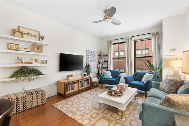 519 Harrison Ave Unit 314, Boston, MA 02118 - living room with wood finished floors, ceiling fan, and baseboards