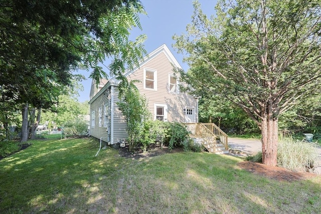 211 Hayden Rowe St, Hopkinton, MA 01748 - view of side of home featuring a lawn and a chimney
