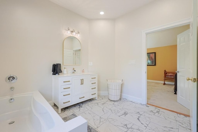 211 Hayden Rowe St, Hopkinton, MA 01748 - bathroom featuring vanity, a bath, marble look tile flooring, and recessed lighting