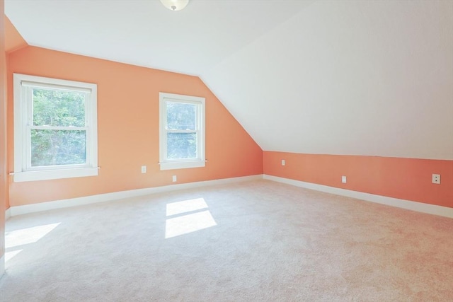 211 Hayden Rowe St, Hopkinton, MA 01748 - additional living space featuring vaulted ceiling, healthy amount of natural light, and light colored carpet