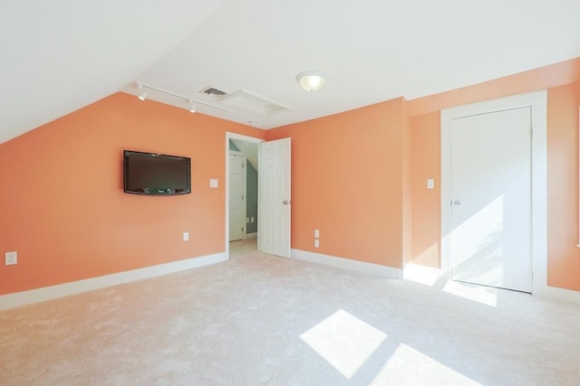 211 Hayden Rowe St, Hopkinton, MA 01748 - spare room featuring light carpet and lofted ceiling