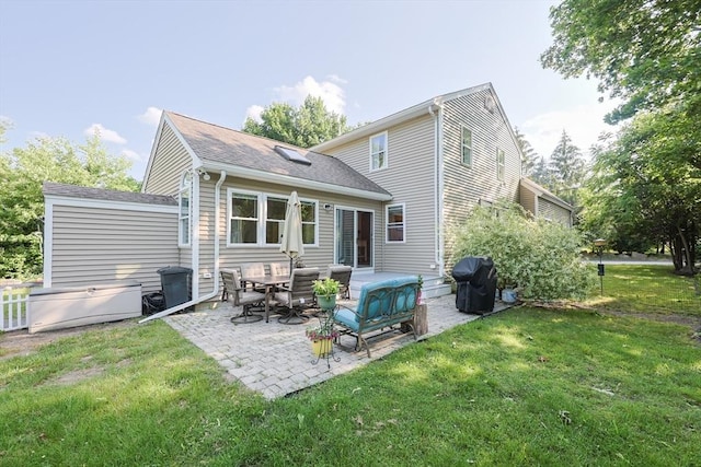 211 Hayden Rowe St, Hopkinton, MA 01748 - rear view of property featuring a patio, a lawn, and a shingled roof