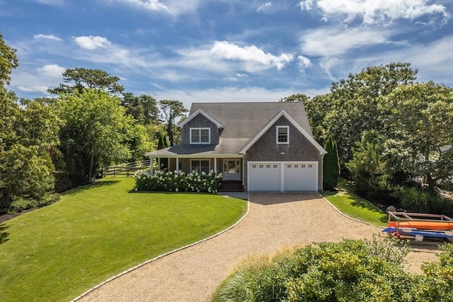 view of front of home featuring dirt driveway, a garage, and a porch