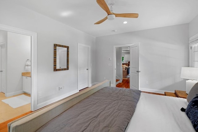 bedroom featuring baseboards, recessed lighting, wood finished floors, connected bathroom, and ceiling fan