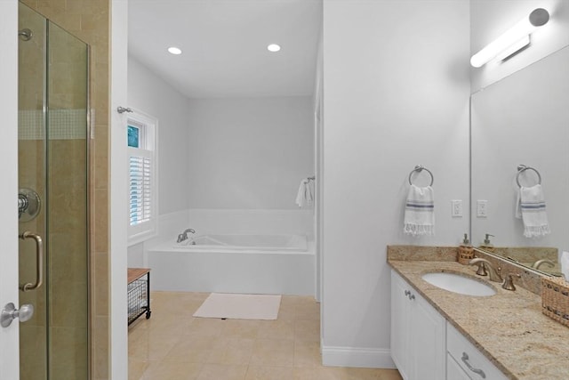 full bath with a stall shower, vanity, a garden tub, and recessed lighting