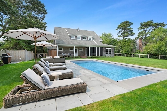 view of swimming pool featuring grilling area and a patio