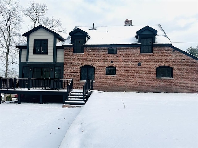 view of snow covered house