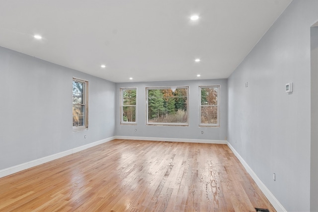 unfurnished room featuring light hardwood / wood-style floors