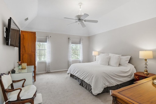 bedroom with light carpet, vaulted ceiling, and ceiling fan