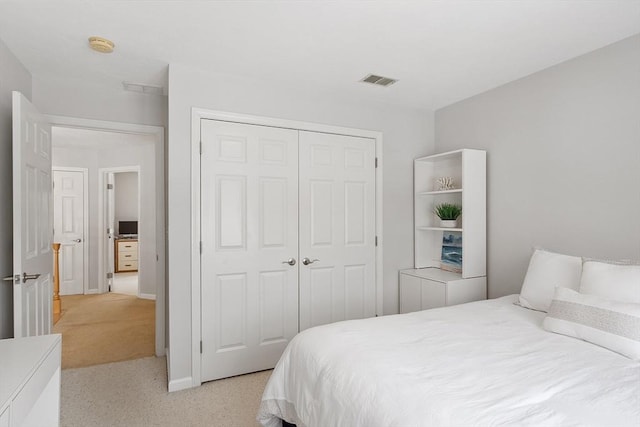 carpeted bedroom with a closet