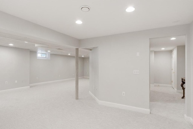 basement with light colored carpet