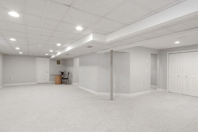 basement featuring carpet flooring