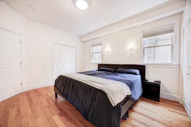 19 Harris St Unit 2, Brookline, MA 02446 - bedroom featuring ornamental molding, light wood finished floors, baseboards, and a closet