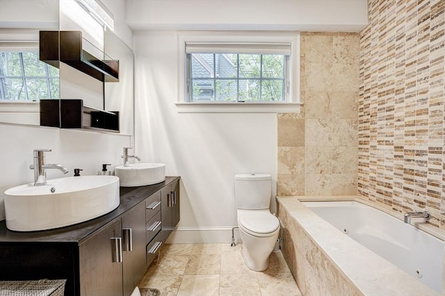 19 Harris St Unit 2, Brookline, MA 02446 - full bathroom with a whirlpool tub, plenty of natural light, baseboards, and toilet