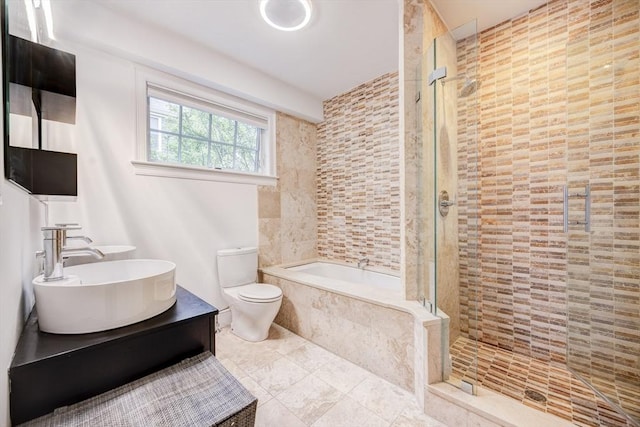 19 Harris St Unit 2, Brookline, MA 02446 - full bathroom featuring a sink, tiled shower, a garden tub, toilet, and tile walls