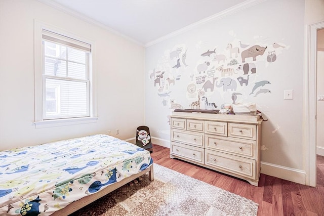19 Harris St Unit 2, Brookline, MA 02446 - bedroom featuring light wood-style flooring, baseboards, and crown molding