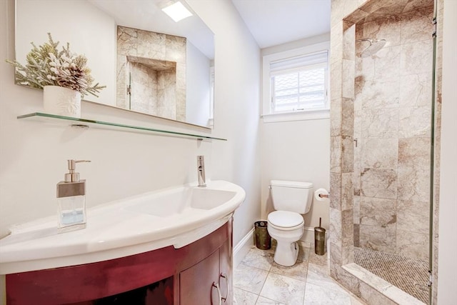 19 Harris St Unit 2, Brookline, MA 02446 - bathroom featuring a shower stall, toilet, baseboards, and vanity