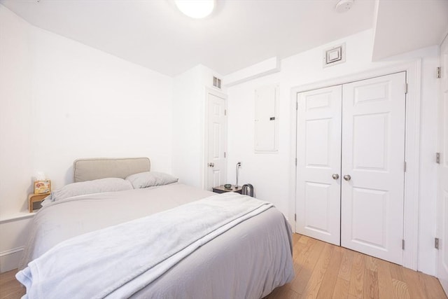 19 Harris St Unit 2, Brookline, MA 02446 - bedroom featuring light wood-style flooring, a closet, and electric panel