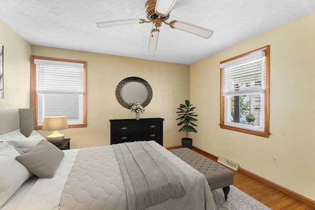 76 N Main St, Bellingham, MA 02019 - bedroom featuring wood finished floors, baseboards, and ceiling fan