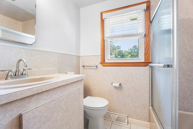 76 N Main St, Bellingham, MA 02019 - bathroom featuring toilet, vanity, tile patterned flooring, and bathtub / shower combination