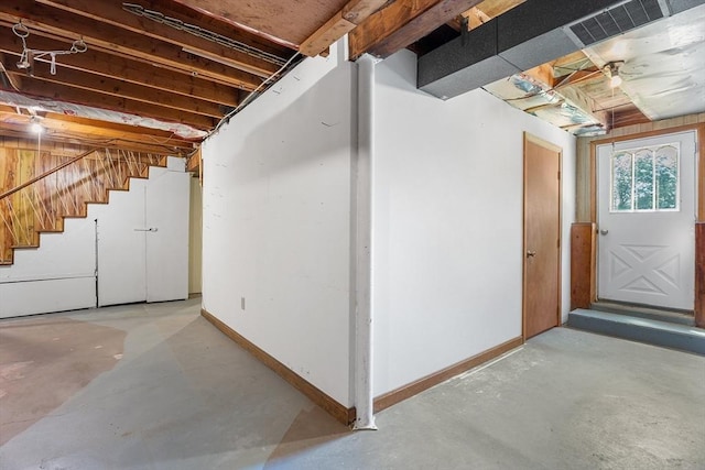 76 N Main St, Bellingham, MA 02019 - basement with baseboards and stairway