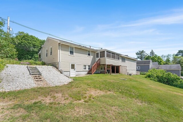 76 N Main St, Bellingham, MA 02019 - rear view of house with a sunroom and a yard