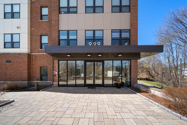 exterior space featuring brick siding