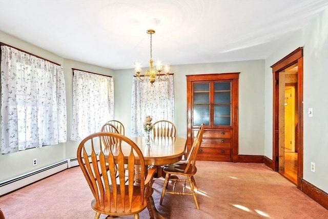 dining space featuring light carpet and an inviting chandelier