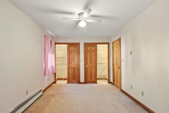 unfurnished bedroom featuring ceiling fan, light colored carpet, and a baseboard heating unit