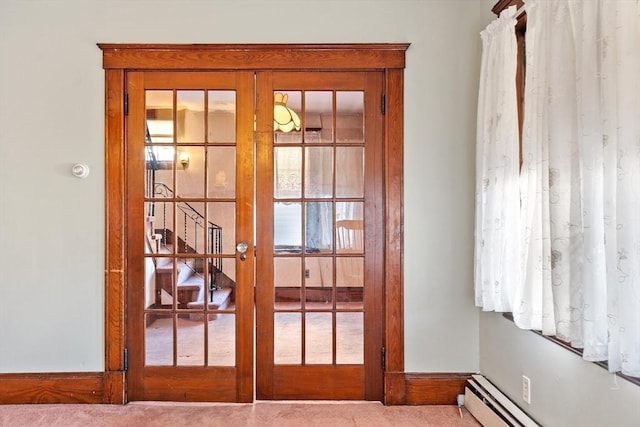 entryway featuring french doors, carpet flooring, and a baseboard radiator