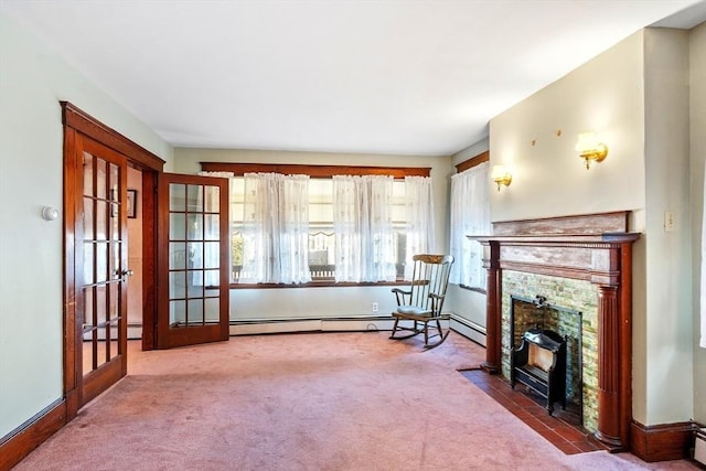 living area with carpet floors, french doors, and a fireplace