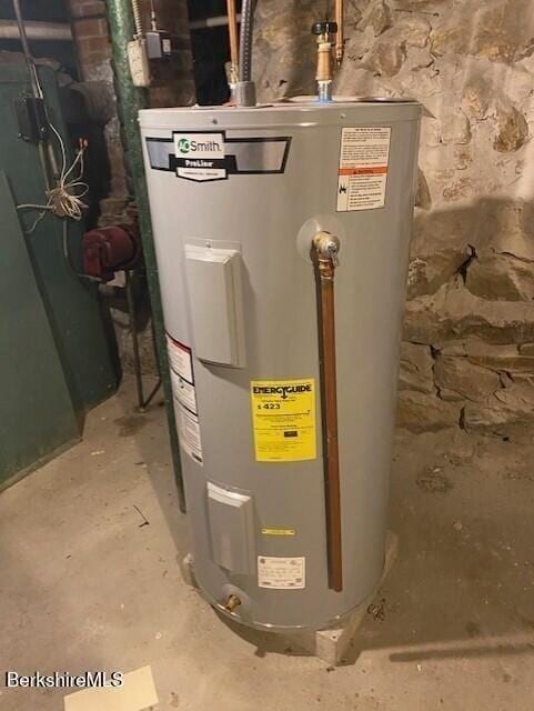 utility room featuring water heater