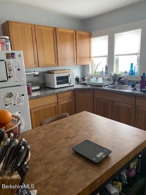 kitchen with sink and white appliances