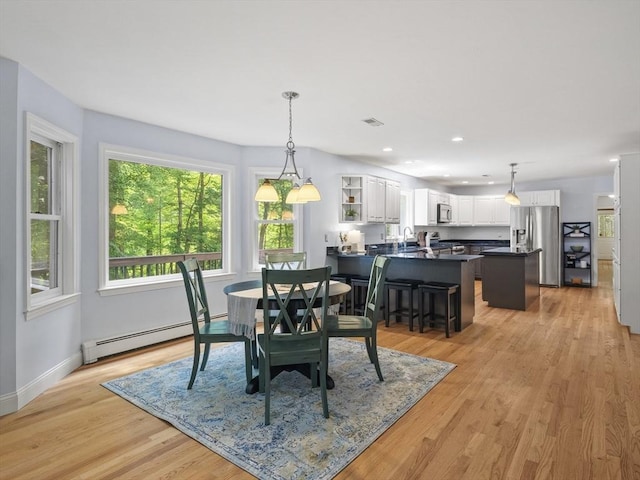 200 Newtown Rd, Acton, MA 01720 - dining area with baseboard heating, light wood-style floors, and recessed lighting