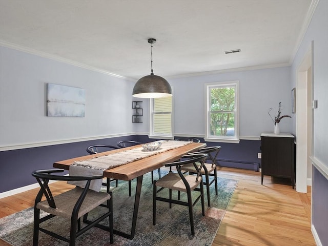 200 Newtown Rd, Acton, MA 01720 - dining room featuring crown molding, light wood-type flooring, and a baseboard heating unit